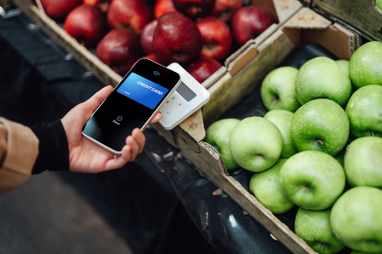 Making contactless payment with smart phone at farmers market