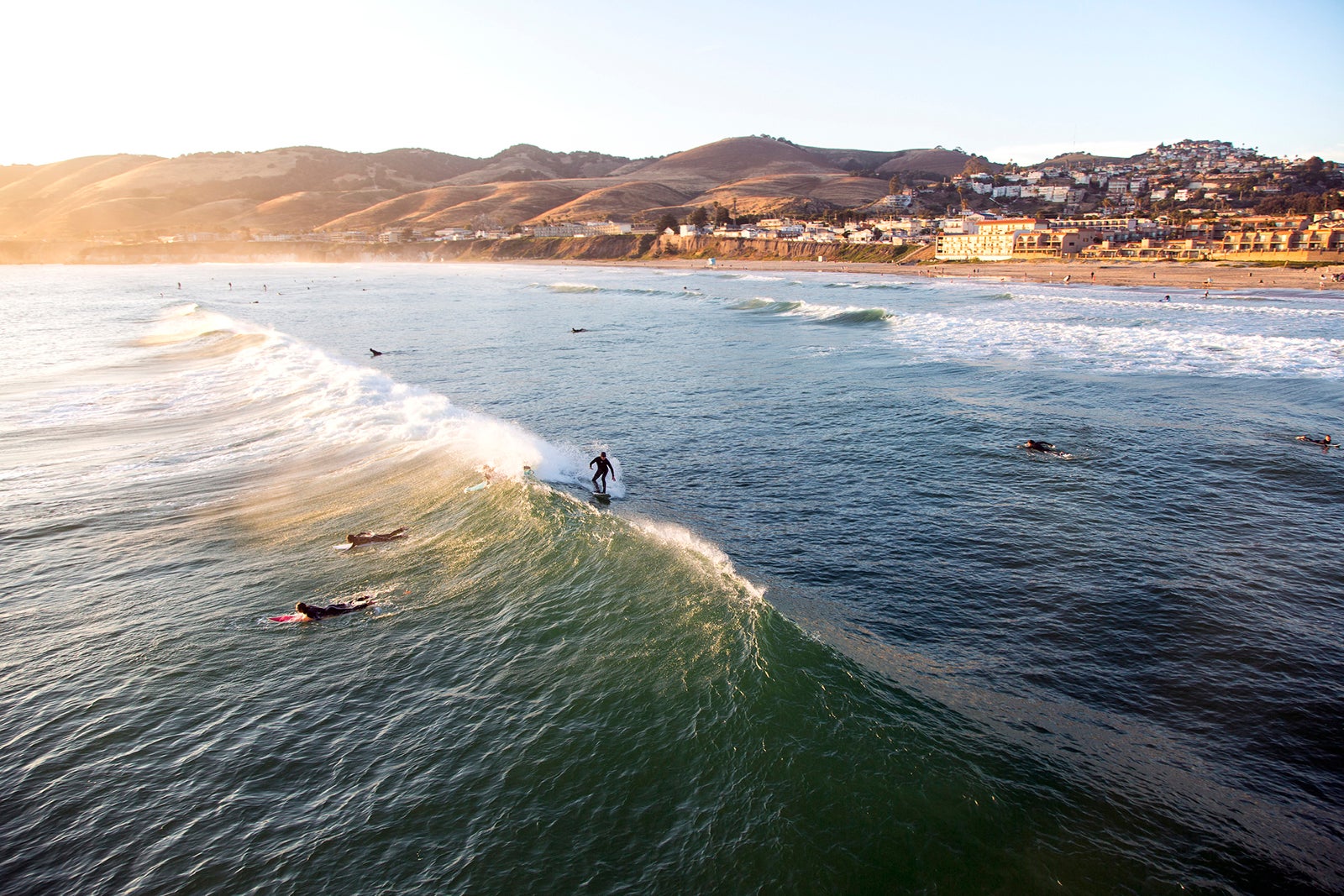 https://thepointsguy.global.ssl.fastly.net/us/originals/2023/03/Surfers-at-Sunset-at-Pismo-Beach-in-San-Luis-Obispo-California_-Harri-Jarvelainen-Photography.jpg