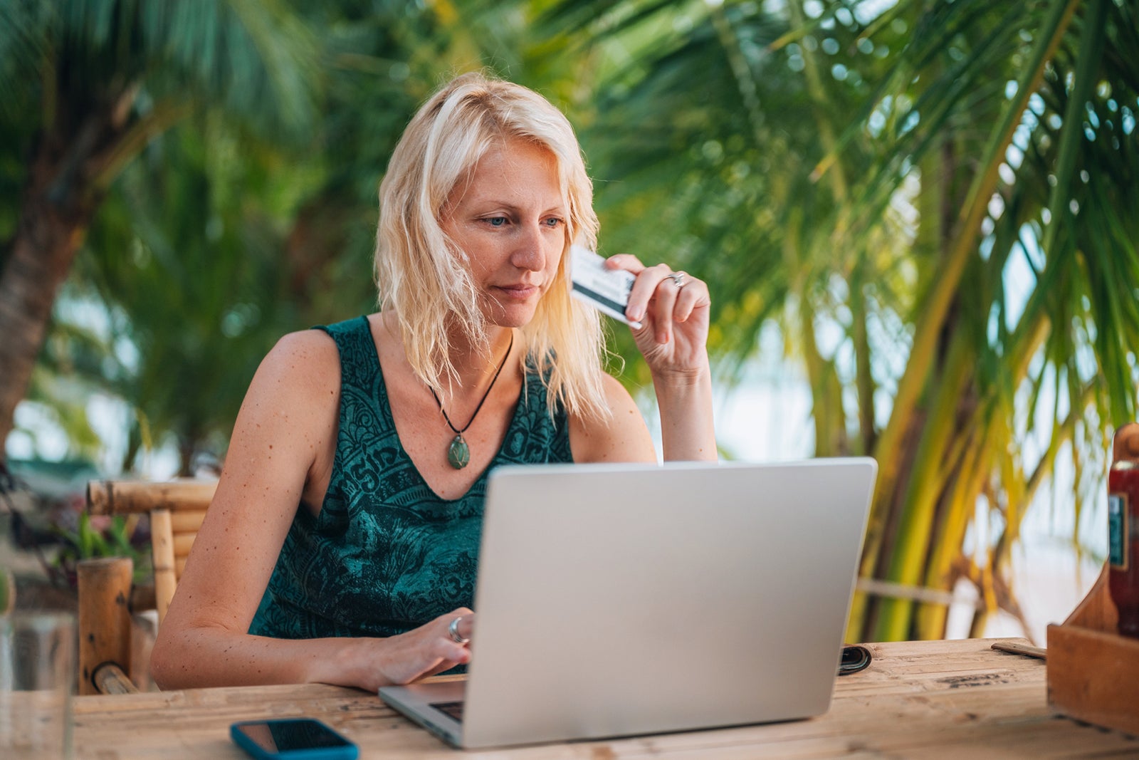 Woman on vacation shopping online