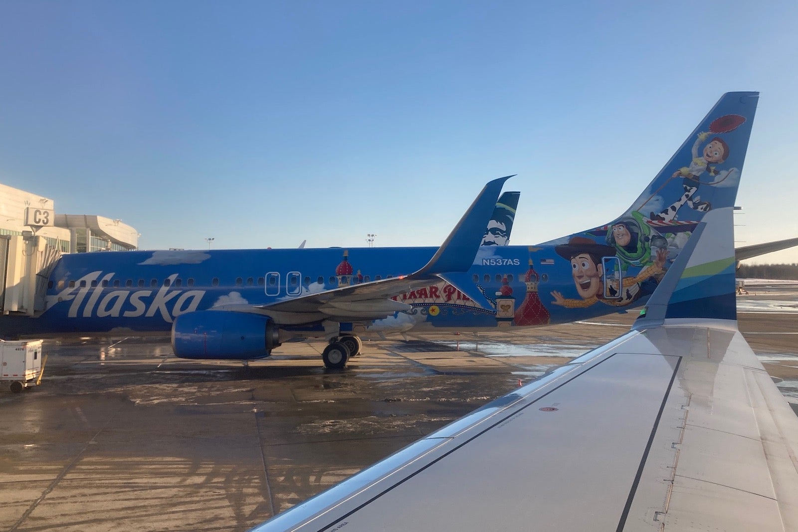 a Pixar-themed Alaska Airlines plane at the Anchorage airport