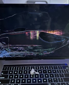 Whose fault is it when your laptop is destroyed by another passenger on a flight?
