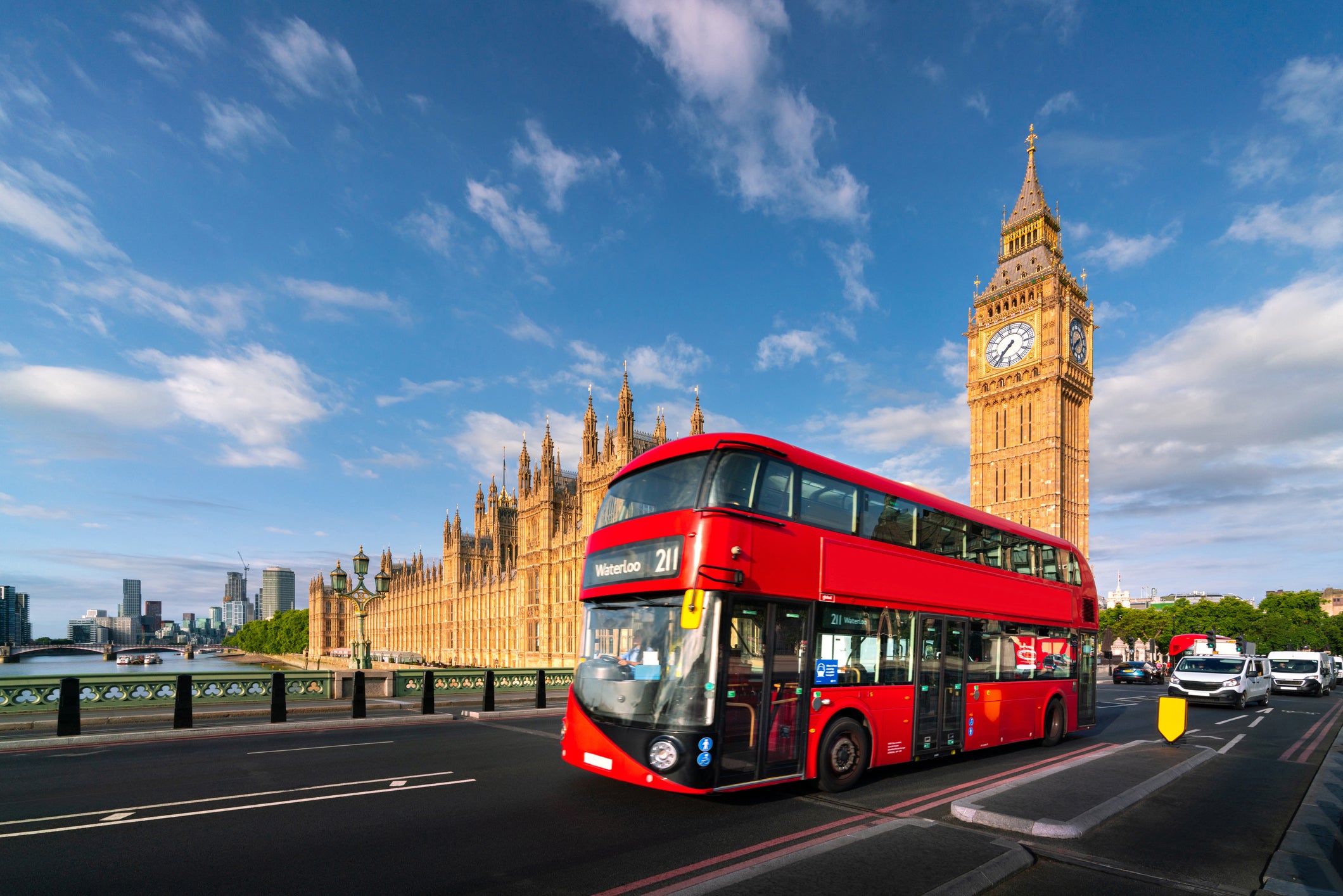Palace of Westminster with Big Ben tower clock or Elizabeth bell and red big bus for passenger public transportation in London, Great Britain, England of United Kingdom, UK