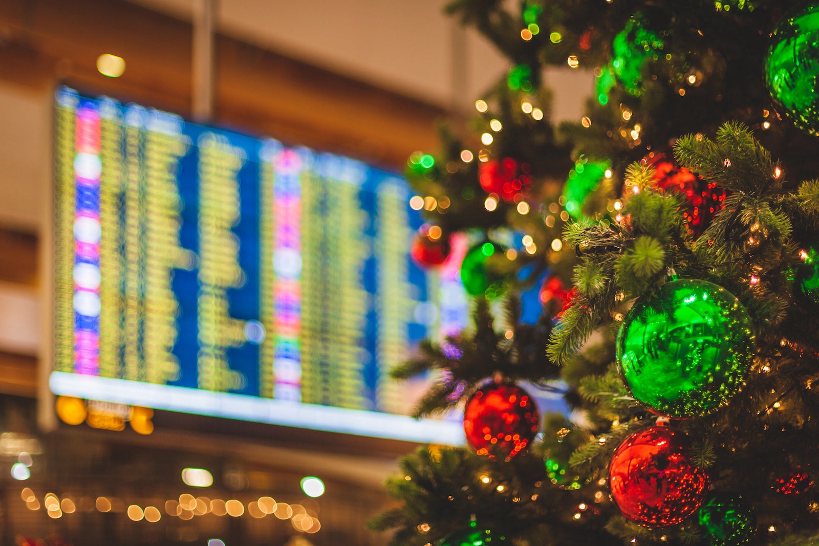 Airport scene - Decorated Christmas Tree with a Flight Departures Display