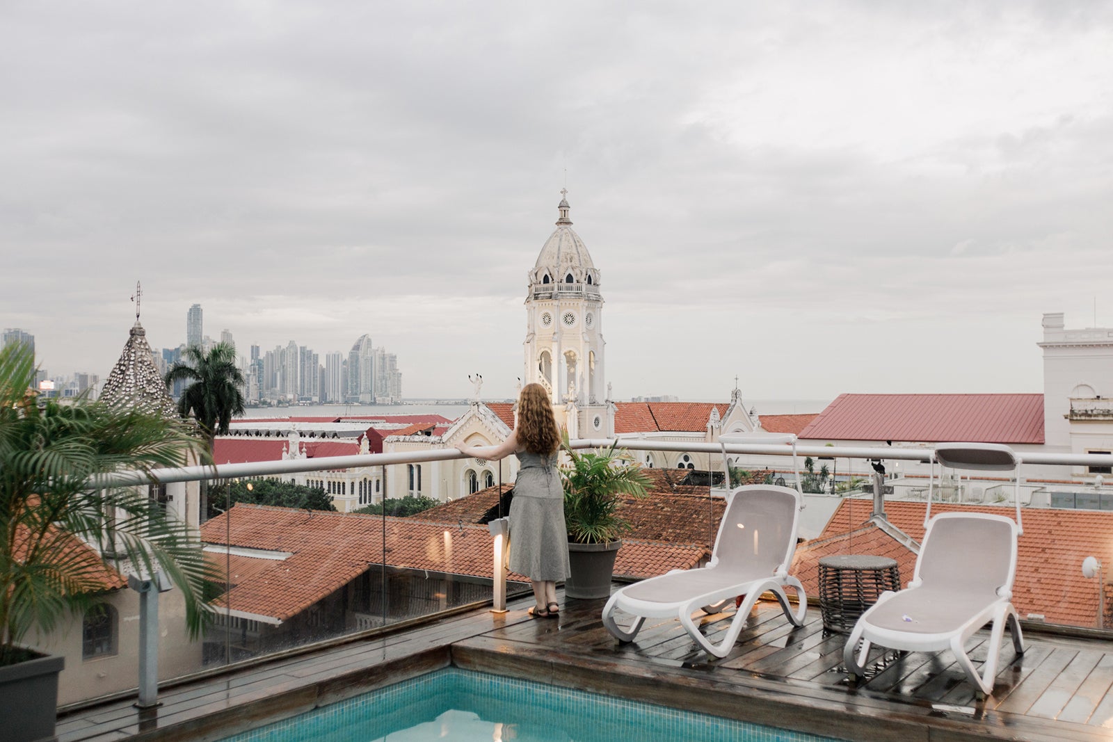 Girl looking at Panama City from a rooftop