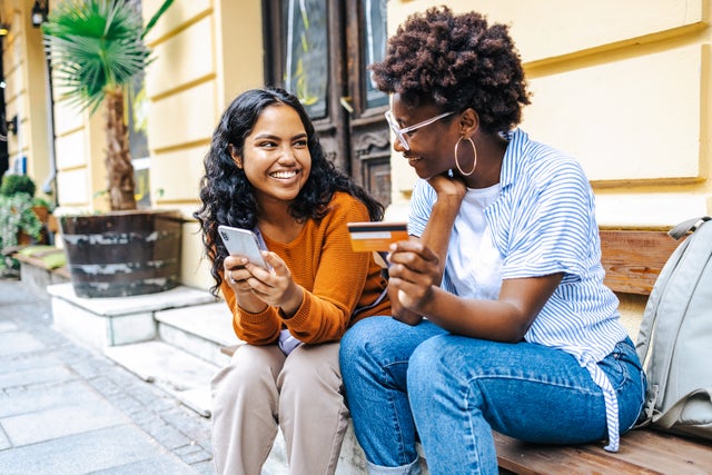 Young woman using e-commerce services in the city