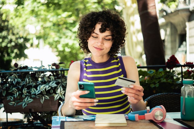 Portrait of a beautiful girl banking online