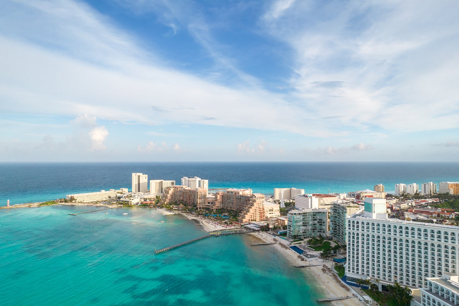 Aerial panoramic view of Cancun beach and city hotel zone in Mexico. Caribbean coast landscape of Mexican resort with beach Playa Caracol and Kukulcan road. Riviera Maya in Quintana roo region on Yucatan Peninsula