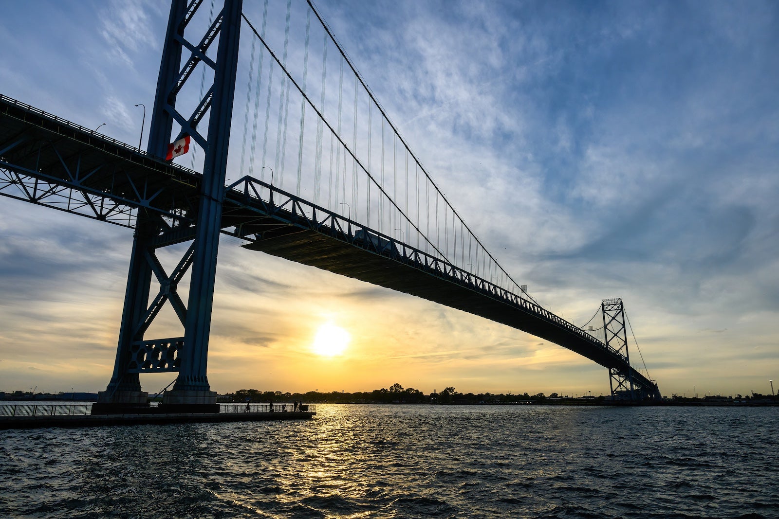 Sunset by the Ambassador Bridge. The structure is above the