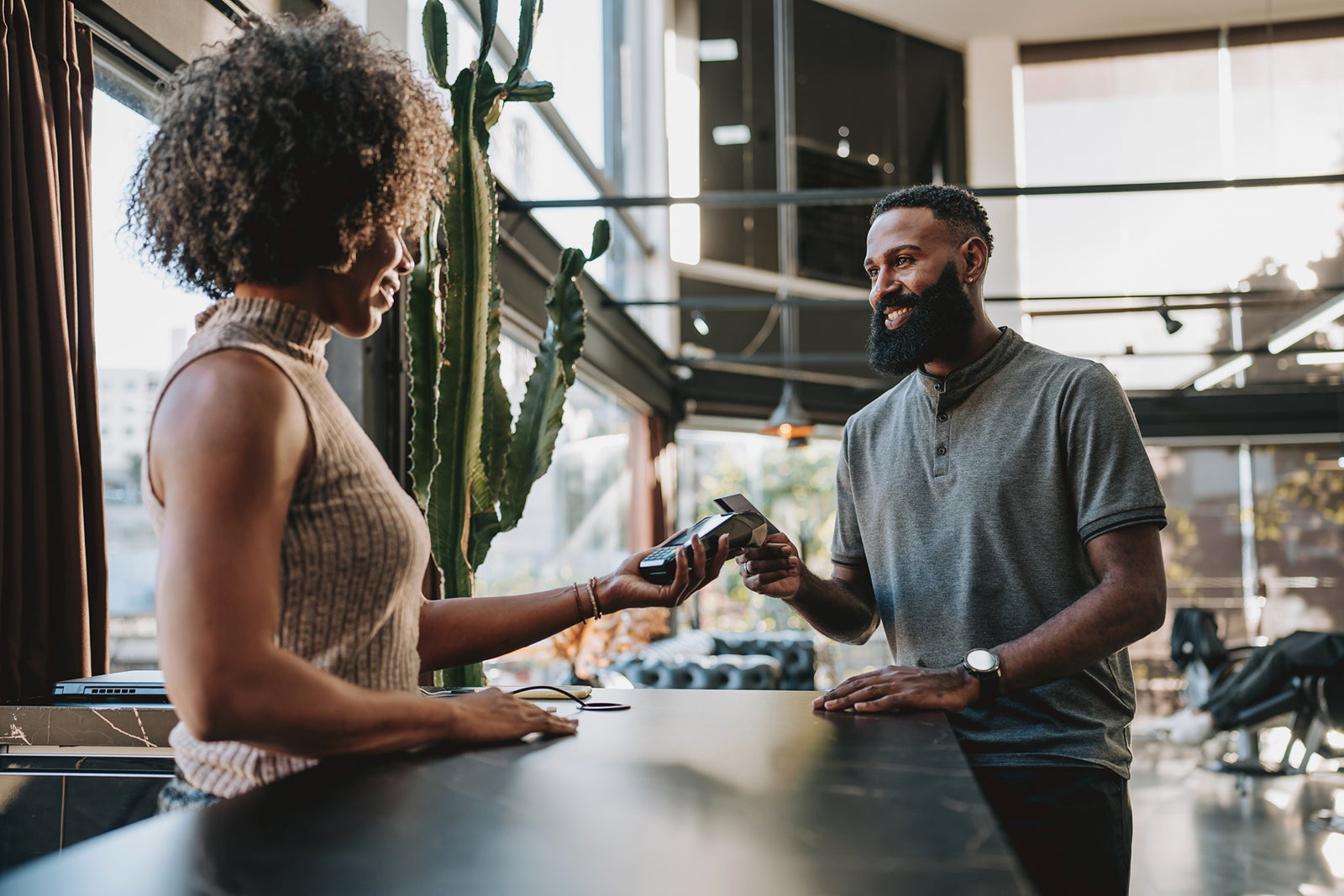 Man making contactless payment with credit card andreswd