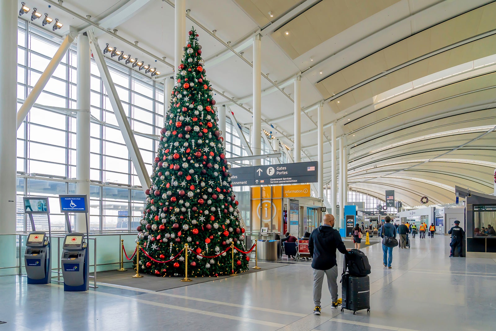 A passenger passed by a Christmas tree at Pearson Airport in Toronto.