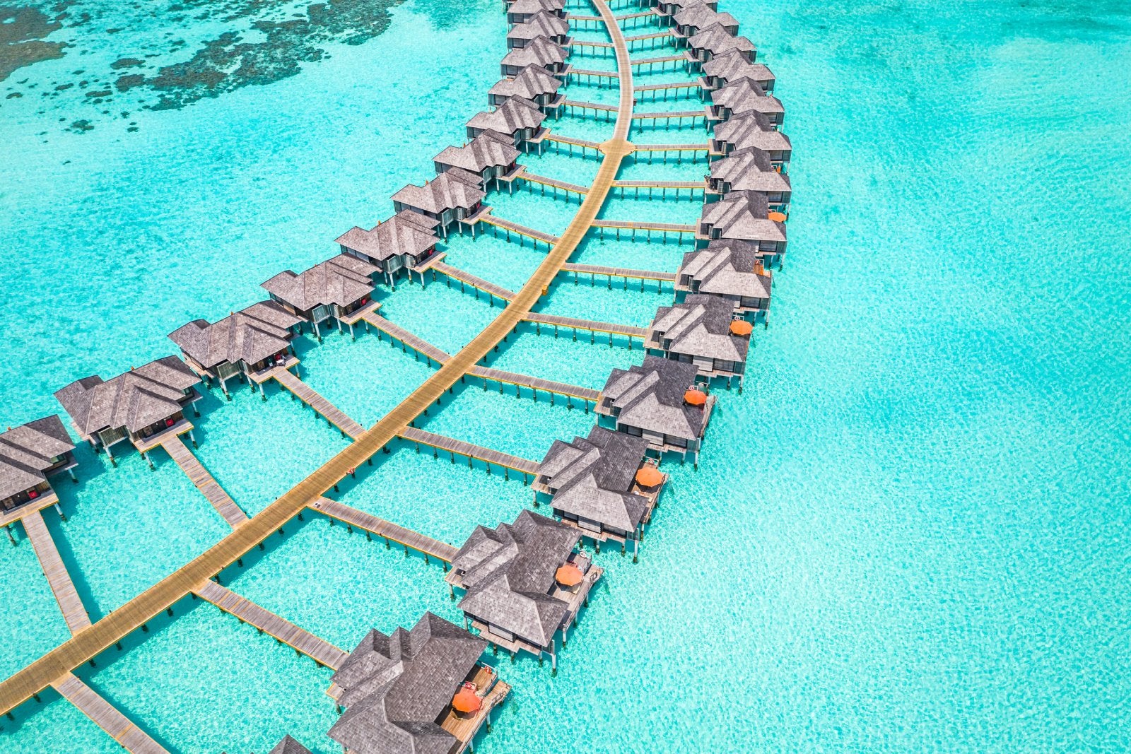 Maldives paradise scenery. Tropical aerial landscape, seascape with long jetty, water villas with amazing sea and lagoon beach, tropical nature. Exotic tourism destination banner, summer vacation