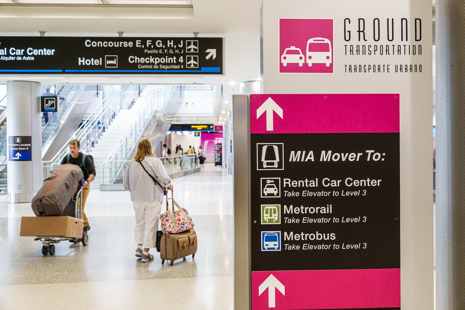 Miami, Florida, Miami International Airport, MIA Mover, Rental Car Center and ground transportation signs in terminal